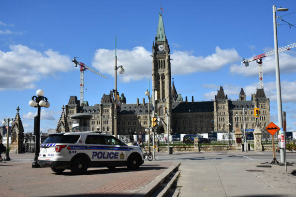 Parliament Of Canada, Ottawa, Ontario, Canada, Police Land Vehicle, People Scene Canada Police, Parliamentary Protective Service Land Vehicle, Security Officer, People Walking, Taking Picture, Canada Parliament Under Renovation, Beautiful Sky Scene During Autumn Season In Ottawa Ontario Canada police station canada stock pictures, royalty-free photos & images