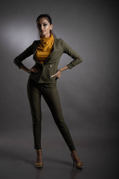 istock Young Indian female model wearing semi-formal olive green suit 1357459930