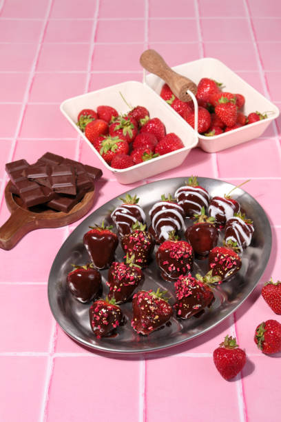 istock Strawberries dipped in Chocolate for romantic dessert in pink kitchen 1357460202