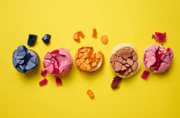 istock broken round macarons with crumbs on a yellow background, delicious dessert 1357461321