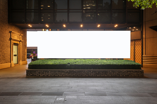 Illuminated billboard at night.