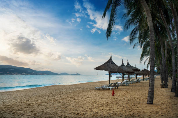 Empty beach of Nha Trang at sunset Empty beach of Nha Trang at sunset nha trang beach stock pictures, royalty-free photos & images