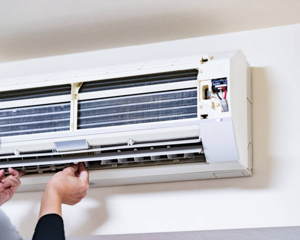 istock Cleaning Air conditioner in living room 1357466492