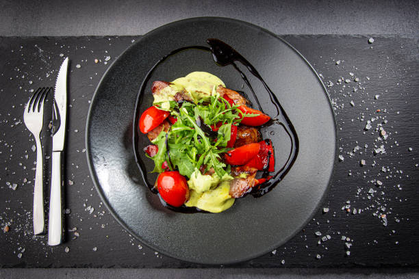 istock Salad with Glazed meat, arugula, grilled bell pepper and tomatoes. 1357467681
