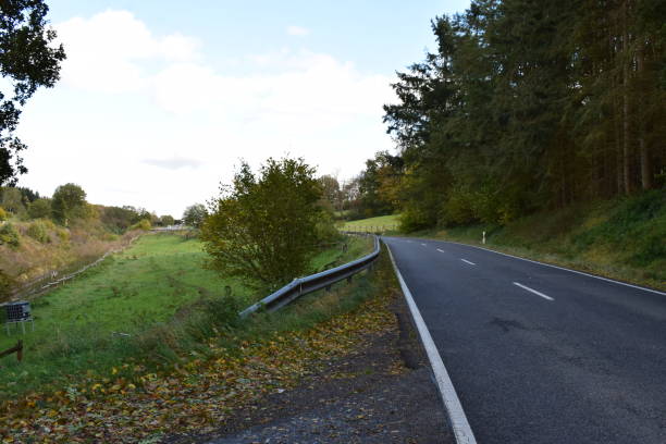 istock Eifel road in autumn near Monreal 1357468326