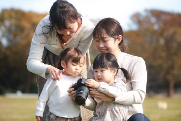 istock Parent and child viewing the captured image 1357468504