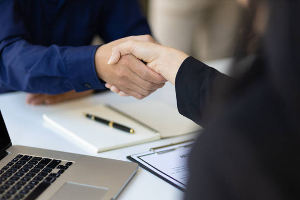 Close up business people handshake in the office. Collaborative teamwork. stock photo