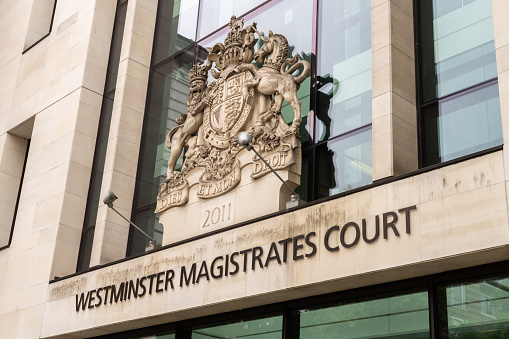 London, England - August 12, 2021: The royal coat of arms above the entrance to Westminster Magistrates’ Court in London, England.