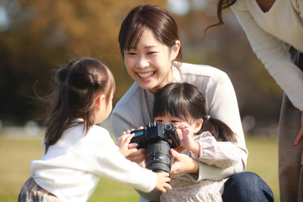 istock Parents and children taking pictures 1357470149
