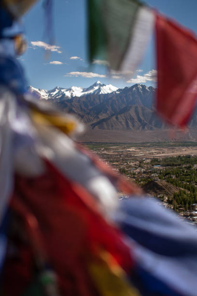 istock Himalyan Mountains trough prayer flags in the wind 1357472277