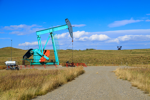 An oil pumpjack in Alberta, Canada. An oil pumjack is the overground drive for a reciprocating piston pump in an oil well.