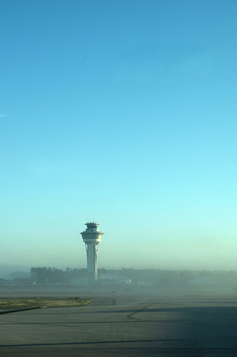 Airport and Jet Airplanes in Foggy Weather Travel Delayed by Air Traffic Control Tower