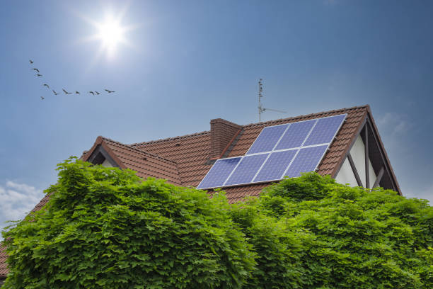 istock House with solar panels on the roof. 1357479223