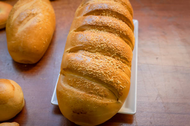 istock Baked breads on wooden table background. 1357479710