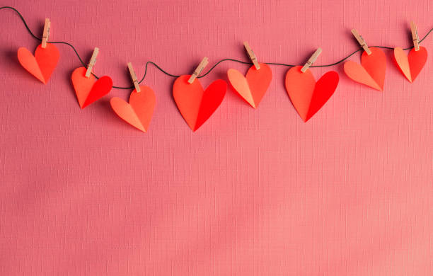 istock Paper hearts hanging on a clothesline with space for copy 1357486214