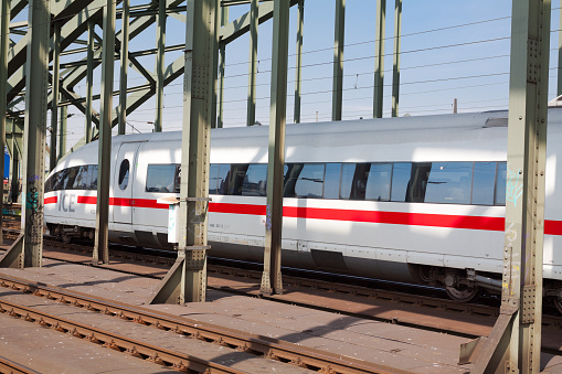 ICE train of Deutsche Bahn is crossing bridge Hollenzoller Bruecke in Cologne