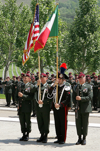 Florence (location I Falciani), Italy - May 25 2009: Celebration of Memorial Day at the Florence American Cemetery and Memorial. Soldiers with the Italian and American flag