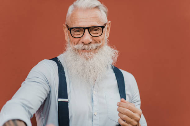 istock Happy senior man looking at camera wearing modern clothes and glasses 1357487345