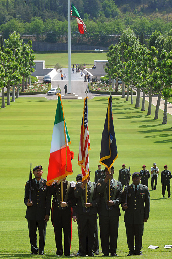 Florence (location I Falciani), Italy - May 25 2009: Celebration of Memorial Day at the Florence American Cemetery and Memorial. Soldiers with the Italian and American flags