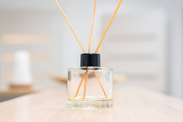 istock Aroma diffuser for perfumed liquid and reed sticks in the room on a wooden table 1357489108