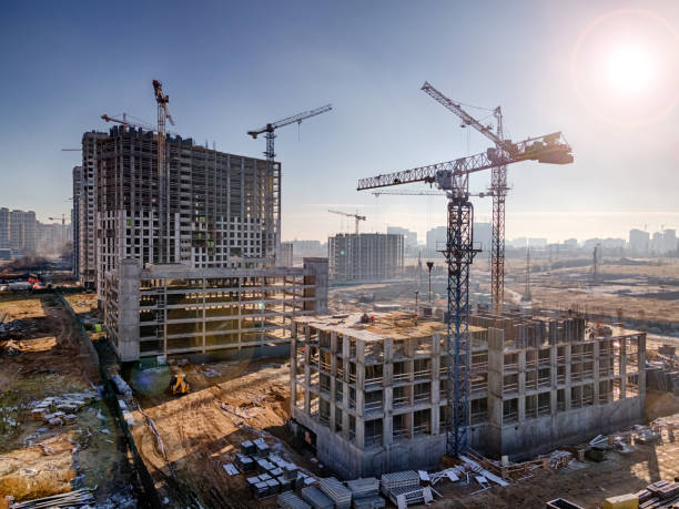 Construction site with cranes, future residential high rises stock photo