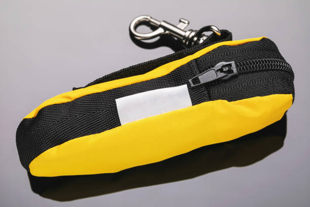 istock Small textile purse with lightning for fingerboard on a gradient background, yellow 1357498704