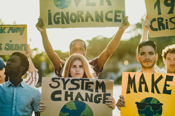 istock Diverse people showing ecological banners 1357502368
