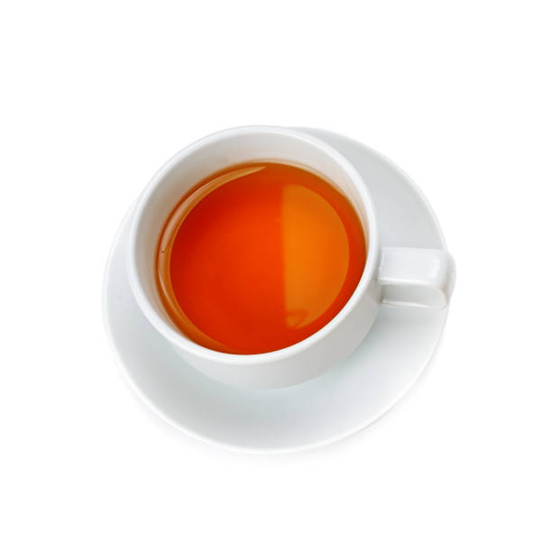 istock Tea in a porcelain cup isolated on white background. View from above. 1357504092