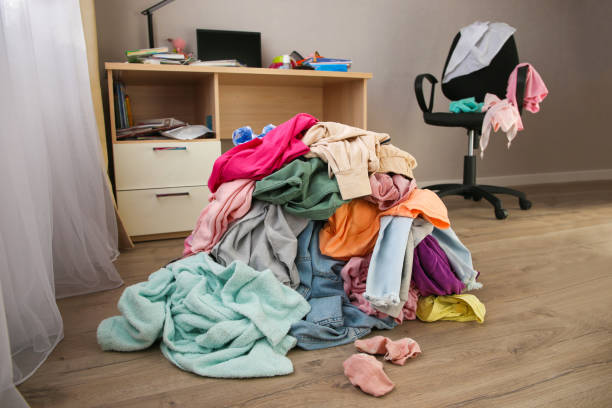 istock Pile of carelessly scattered clothes on floor. 1357505136