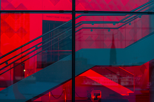 Red Reflection on staircase of woman City Hall in Hamburg - Germany.