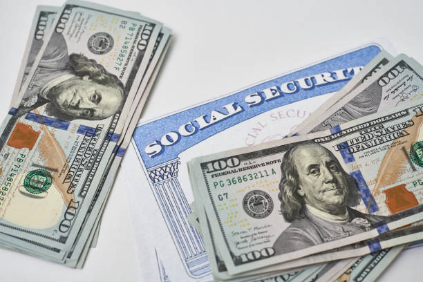 Social security card and us dollars cash money stock photo