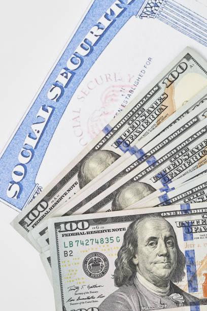 Social security card and us dollars cash money stock photo