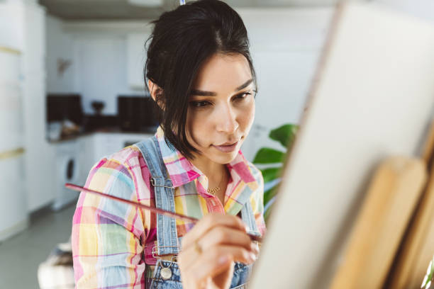 istock pretty woman artist painter teleworking 1357507517