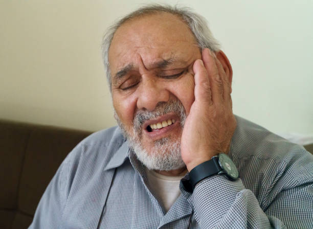 istock Senior adult man having toothache 1357509898