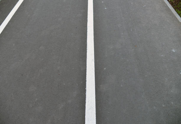 istock New black asphalt close up. 1357510929