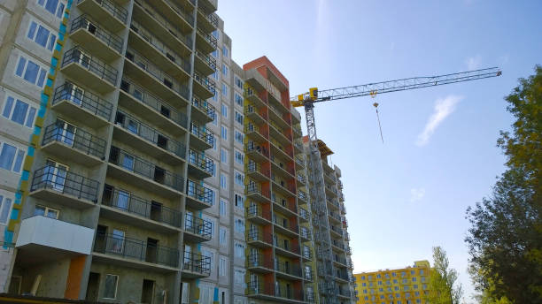 istock Construction site with crane on blue sky background. Civil engineering. Building of new residential house. Real estate investing. Housing development. Sale, rental flat. Industry. Improvement. City 1357512551