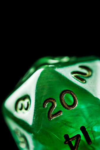 Green twenty sided dice used in role playing games.