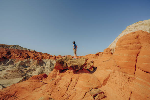 Silhouette of a woman hiking in a wilderness area. Grand Staircase-Escalante national monument, Utah. Silhouette of a woman hiking in a wilderness area. Grand Staircase-Escalante national monument, Utah. grand staircase escalante national monument stock pictures, royalty-free photos & images