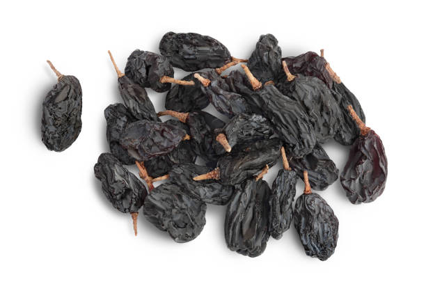 istock Black raisin isolated on white background with clipping path. Top view. Flat lay 1357520218