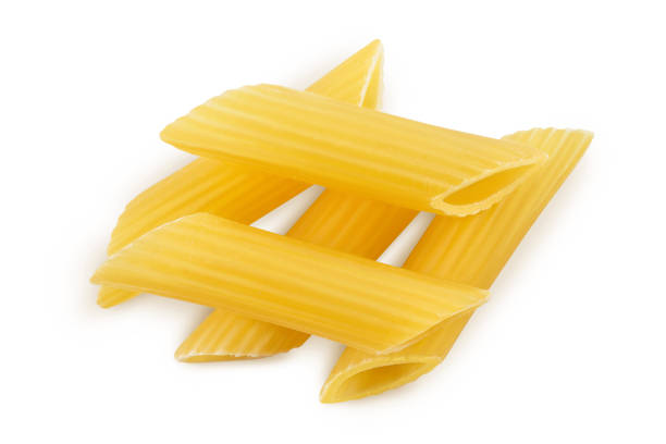 istock Raw italian penne rigate pasta isolated on white background with clipping path and full depth of field. Top view. Flat lay 1357520232