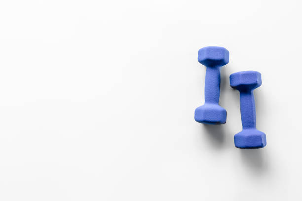Sports dumbbells flat lay isolated on white.