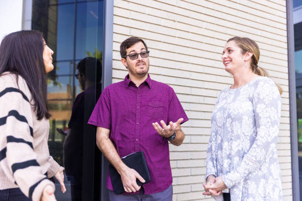 istock Young Academic Administrators Walking and Meeting 1357520538