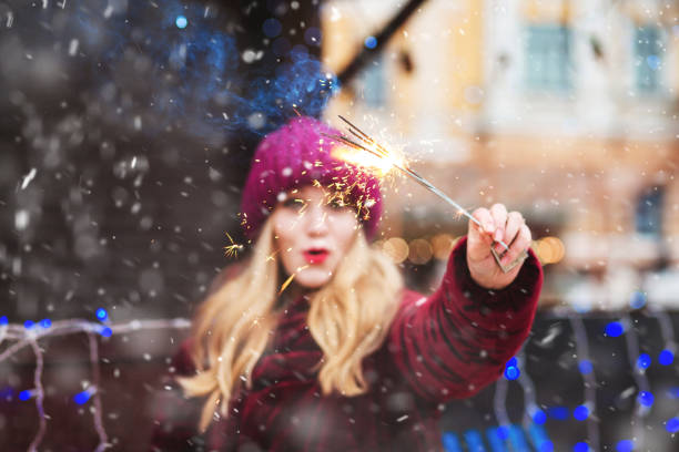 istock Positive lady playing with bengal lights 1357520843