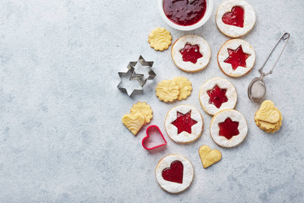 istock Classic Linzer Christmas Cookies with raspberry or strawberry jam on light background. 1357521979