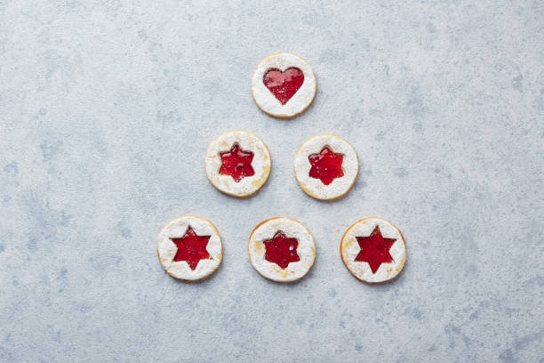 istock Classic Linzer Christmas Cookies with raspberry or strawberry jam on light background. 1357522082