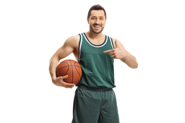 istock Basketball player holding a ball and pointing 1357522088