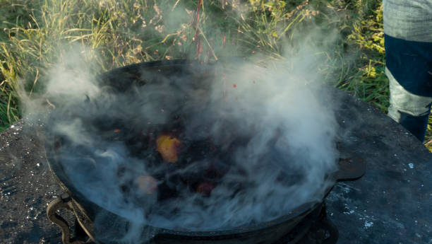istock Mulled wine in a large cauldron. Mulled wine is cooked in a large pot. Vitamins in the traditional festival. 1357522724