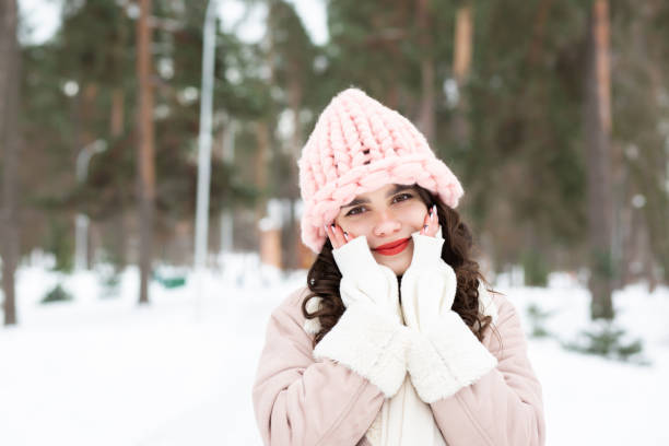 istock Lovely young lady walking at the winter forest 1357522784