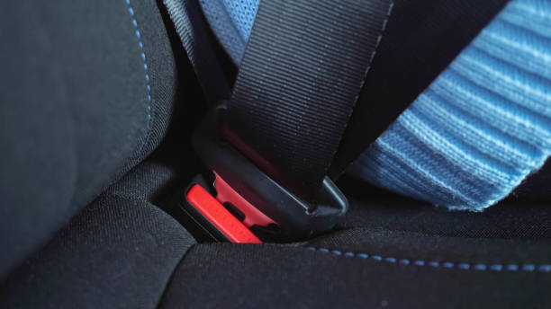 istock Passenger is fastens seat belt sitting inside automobile 1357523899