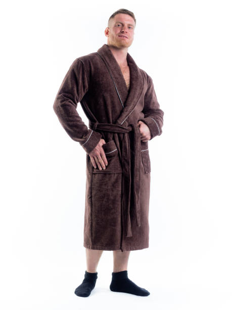 istock strong man in a Bathrobe on an isolated white background with a smile on his face. 1357524866
